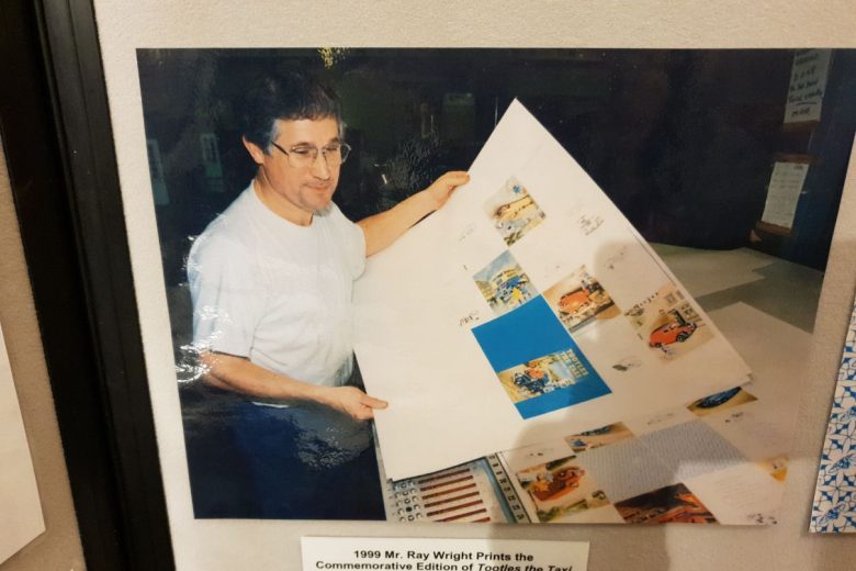 Framed photo of a man book printing in the 90s