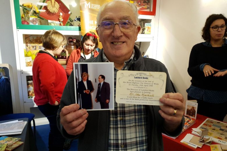 Man holding up a photo of his younger self with Princess Diana