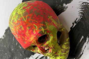 Colourful neon painted clay skull