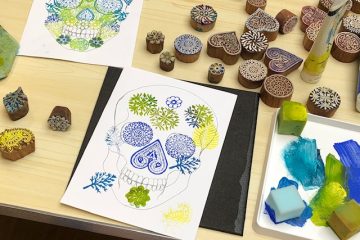 Colourful skull prints with painted sponges and printed wooden blocks on the table