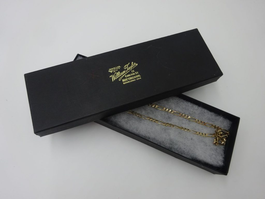 Gold necklace in its box