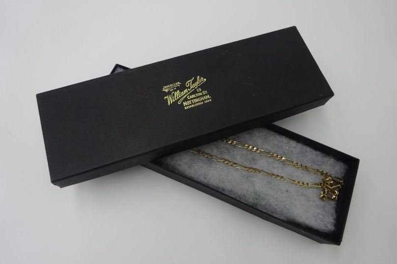 Gold necklace in its box