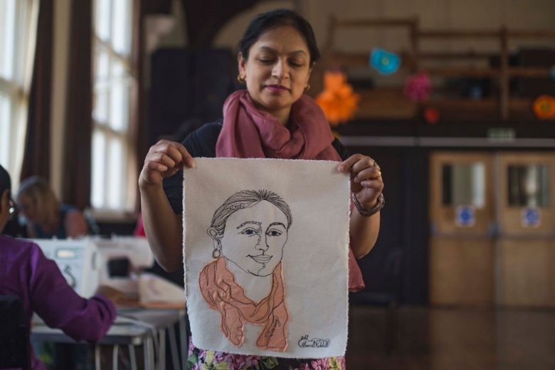 Anand Mangal lady holding up a stitched self protrait