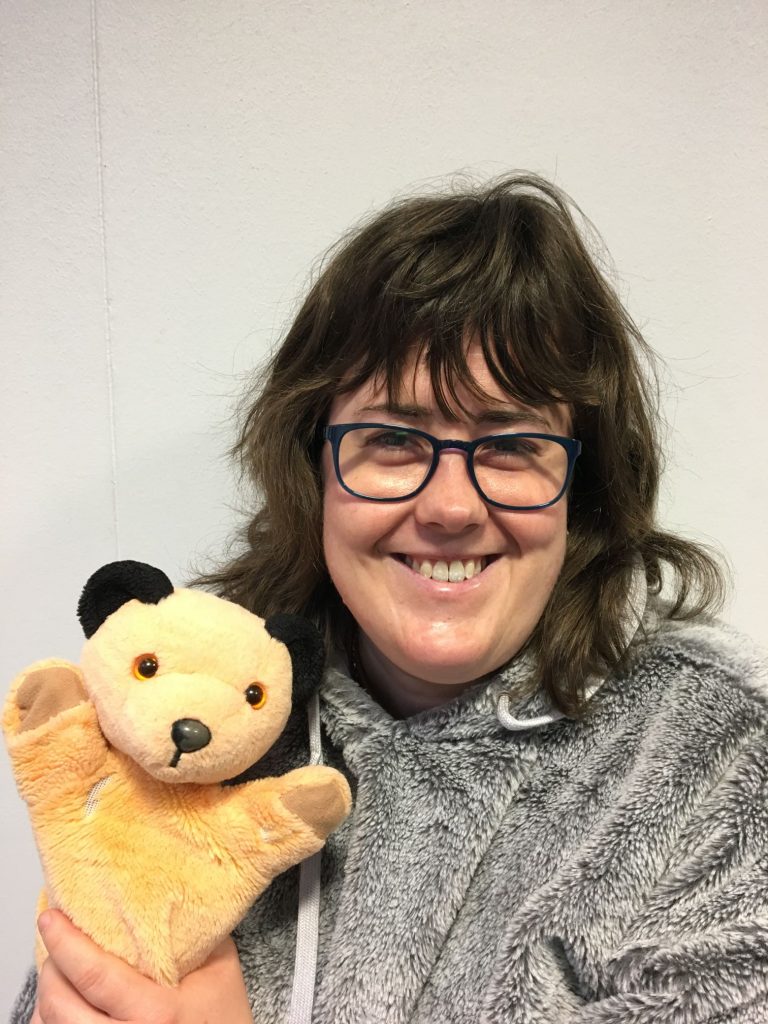 Photo of Esme holding Sooty puppet