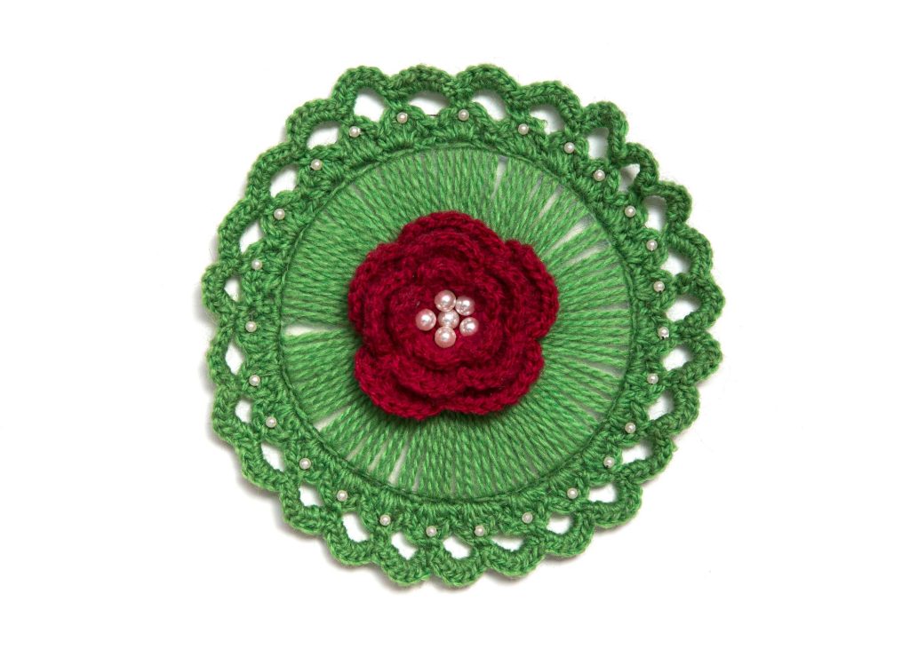 red and green crocheted mat