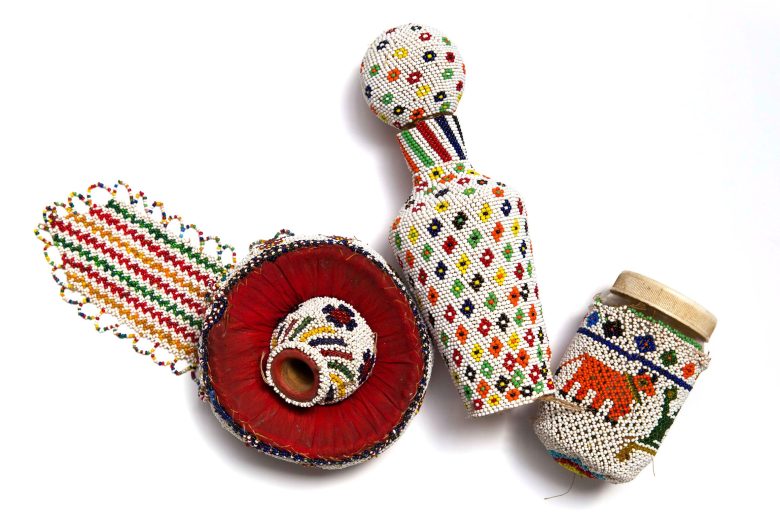 Various small objects with colourful beaded covering