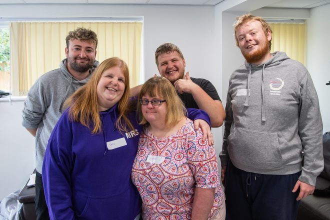 A group of Brookfield Great Glen residents smiling at the camera