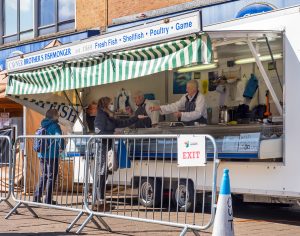 Customer is being served at a fish and meat van