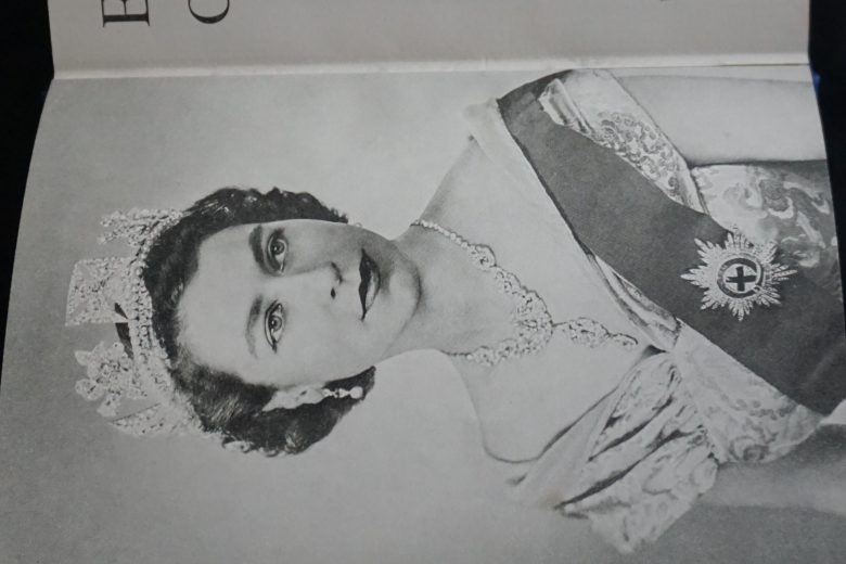 Image of young Queen Elizabeth inside Coronation book