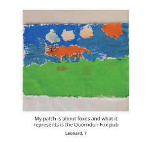 Photo of 7 year old Leonard's patch of a fox stood on some grass. Caption reads: My patch is about foxes and what it represents is the quorndon fox pub