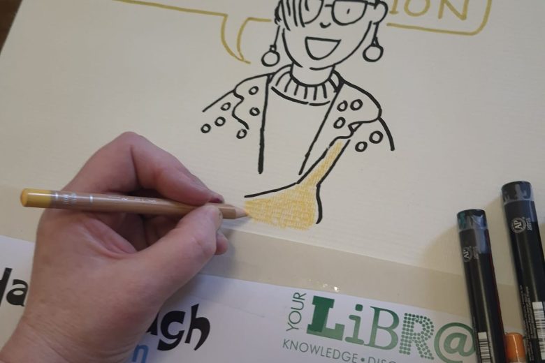 Artist Katy Dynes working on our beautiful new illustrated banner!