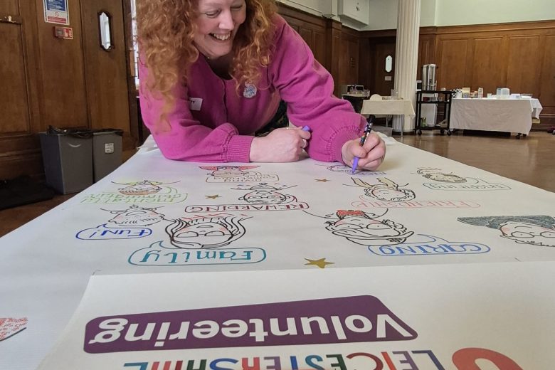 Artist Katy Dynes working on our beautiful new illustrated banner!