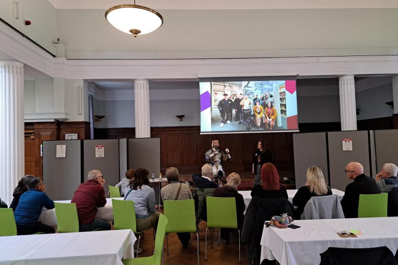 Volunteers enjoying 'Dress the Knight' with expert, Richard Knox!